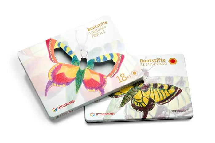 Two butterfly-shaped puzzle pieces with Stockmar branding on a white background