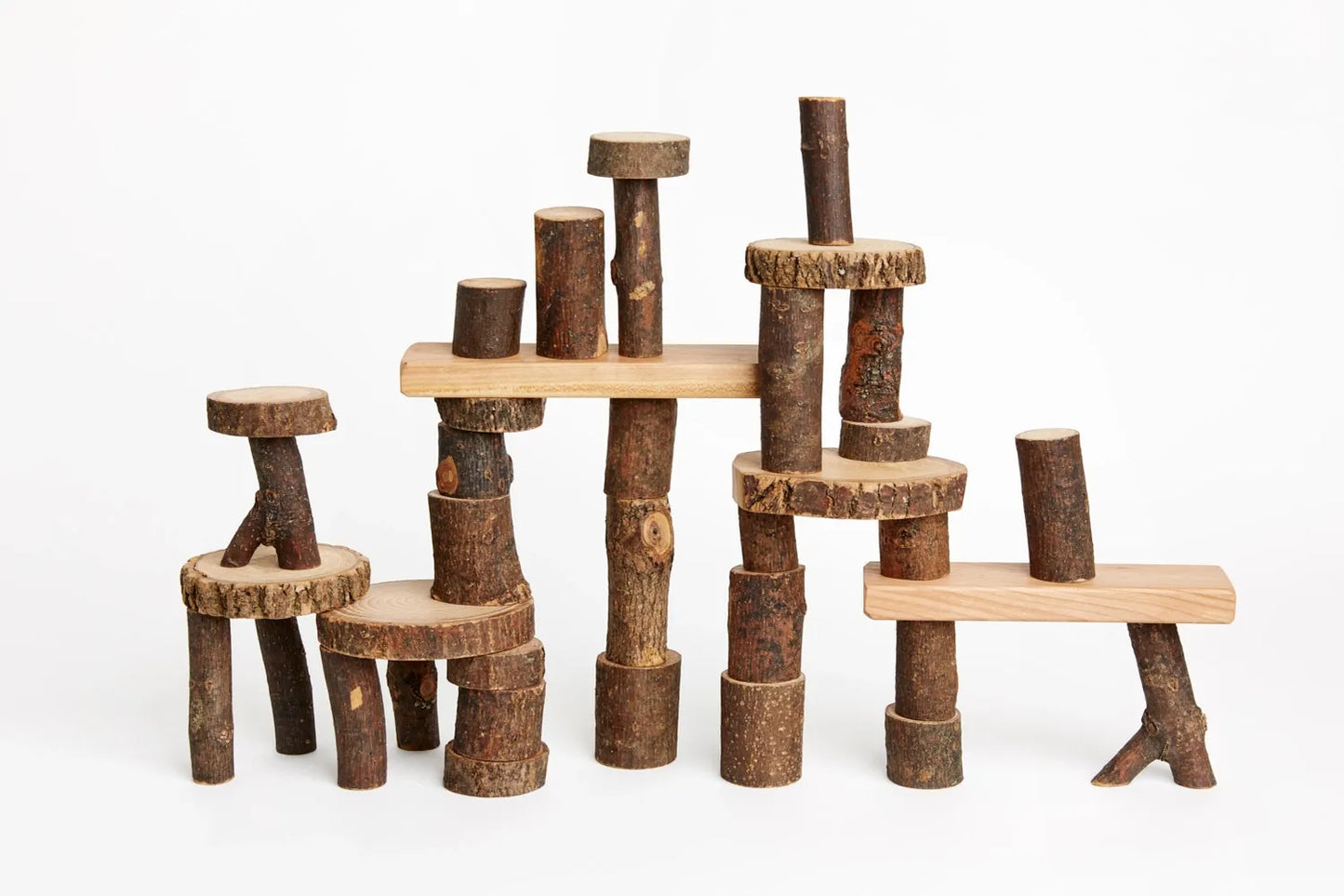 Larger Set Barked Tree Blocks for open ended play stacked against a white background
