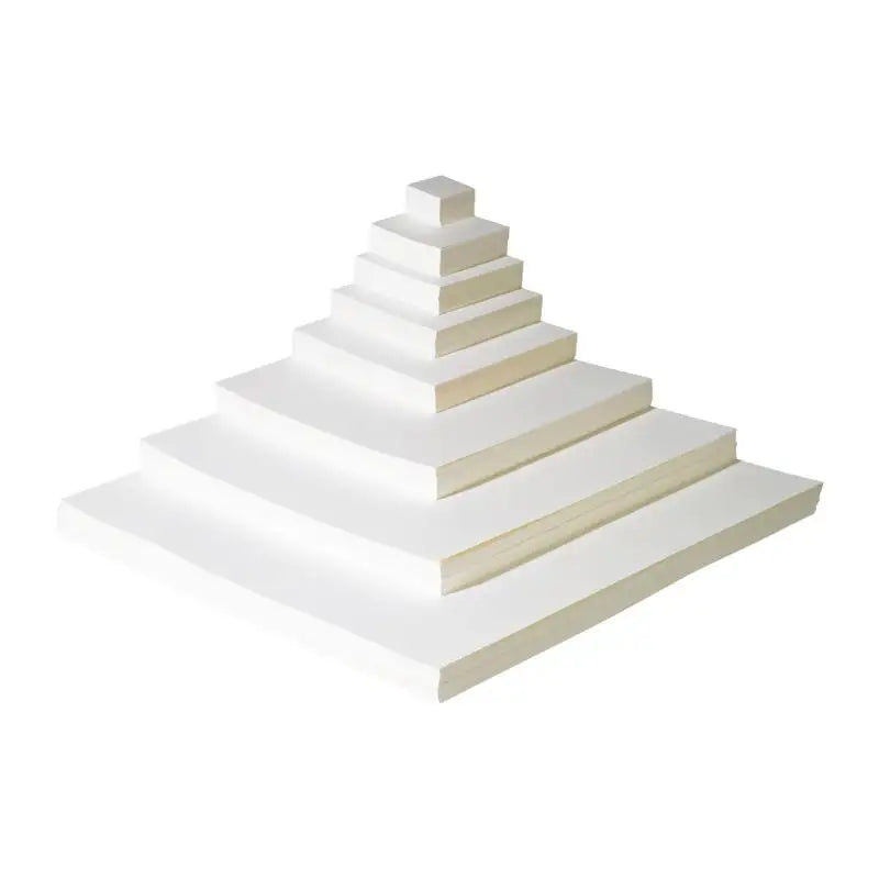 A stack of white Mandala Paper in different sizes on a white background