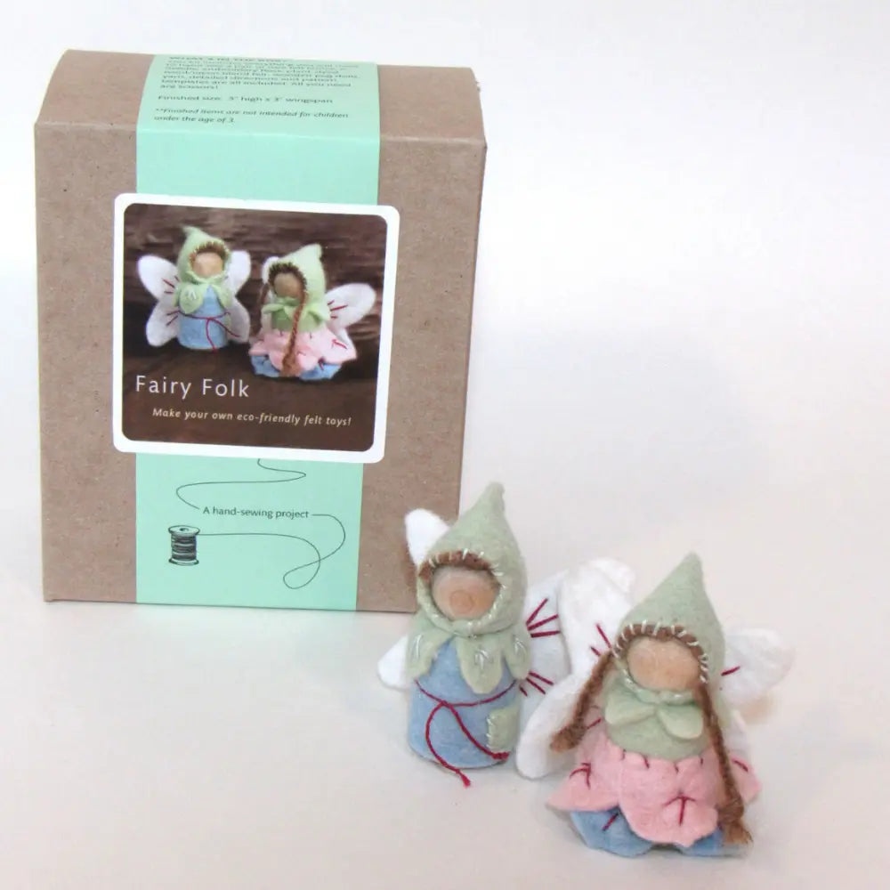 Fairy Folk dolls with a cardboard box and label on a white background