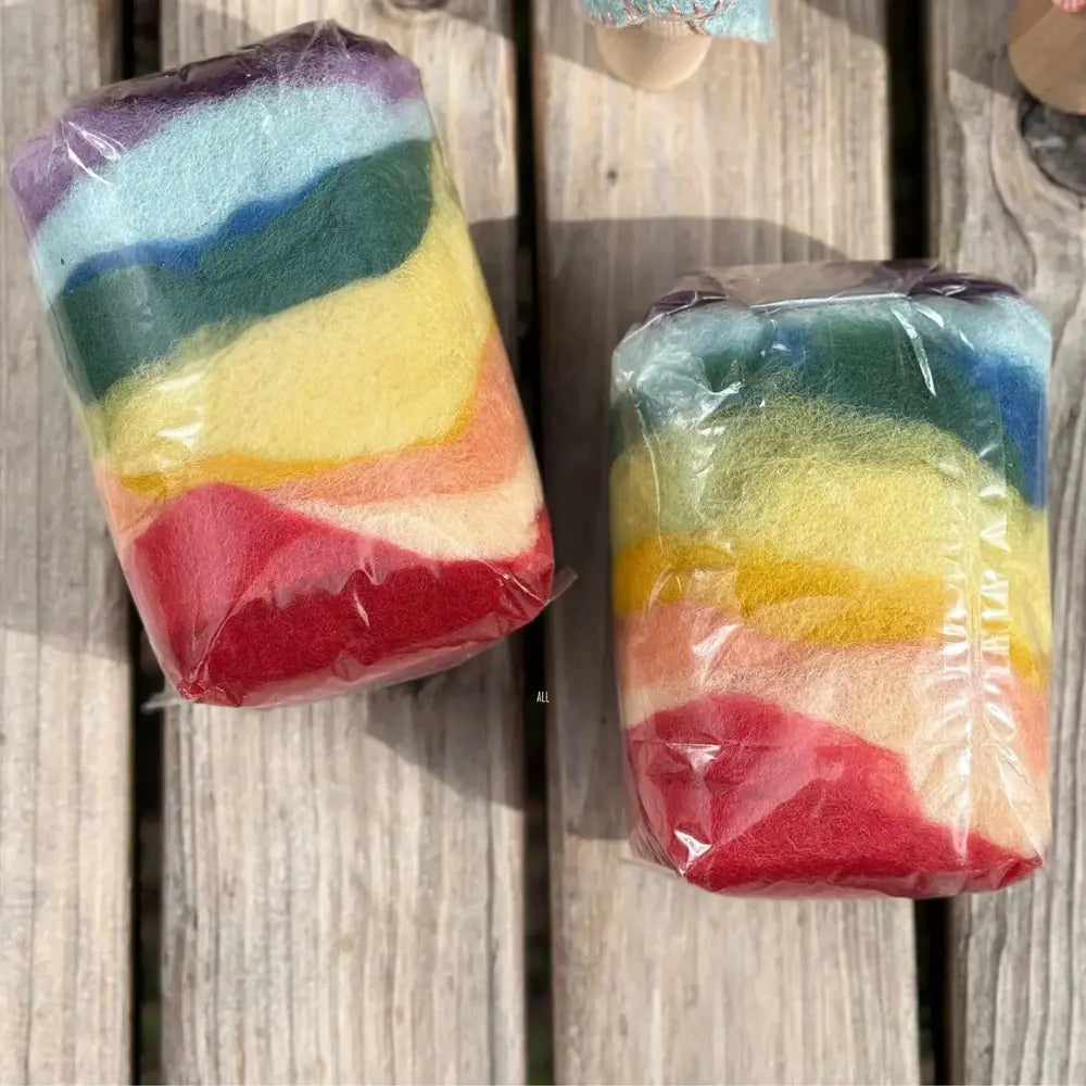 two bags of organic fairy toll wool by Filges on a wooden table