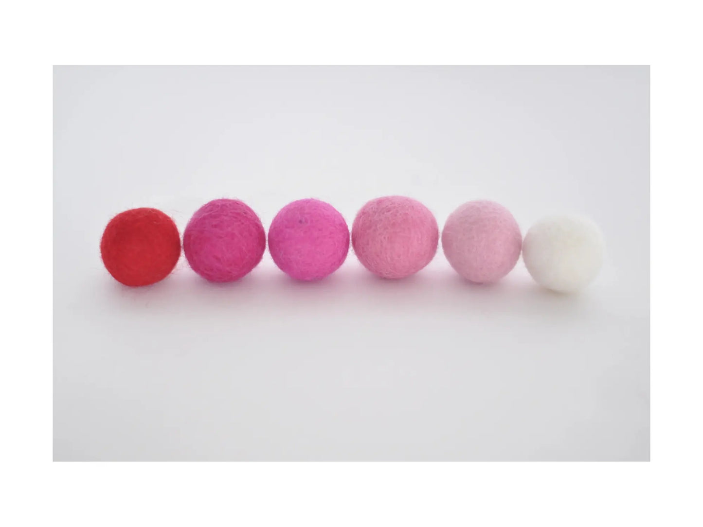 felt wool balls in red, 4 pinks and white for valentine crafts garlands and seasonal decorations