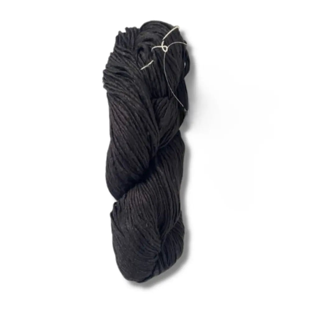 black hank of mulberry silk yarn on a white background