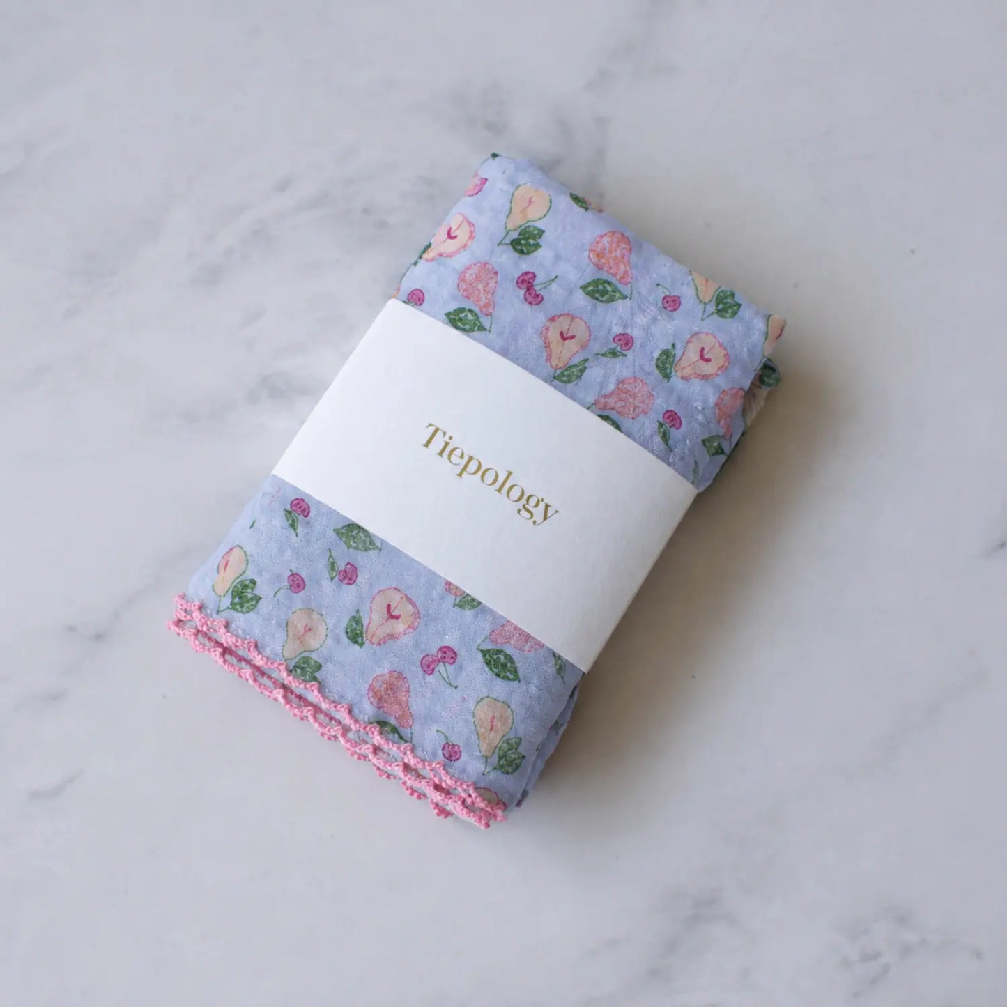 Vintage Pear & Cherry reusable lunch napkin in a pale blue fruit print with pink decorative edging