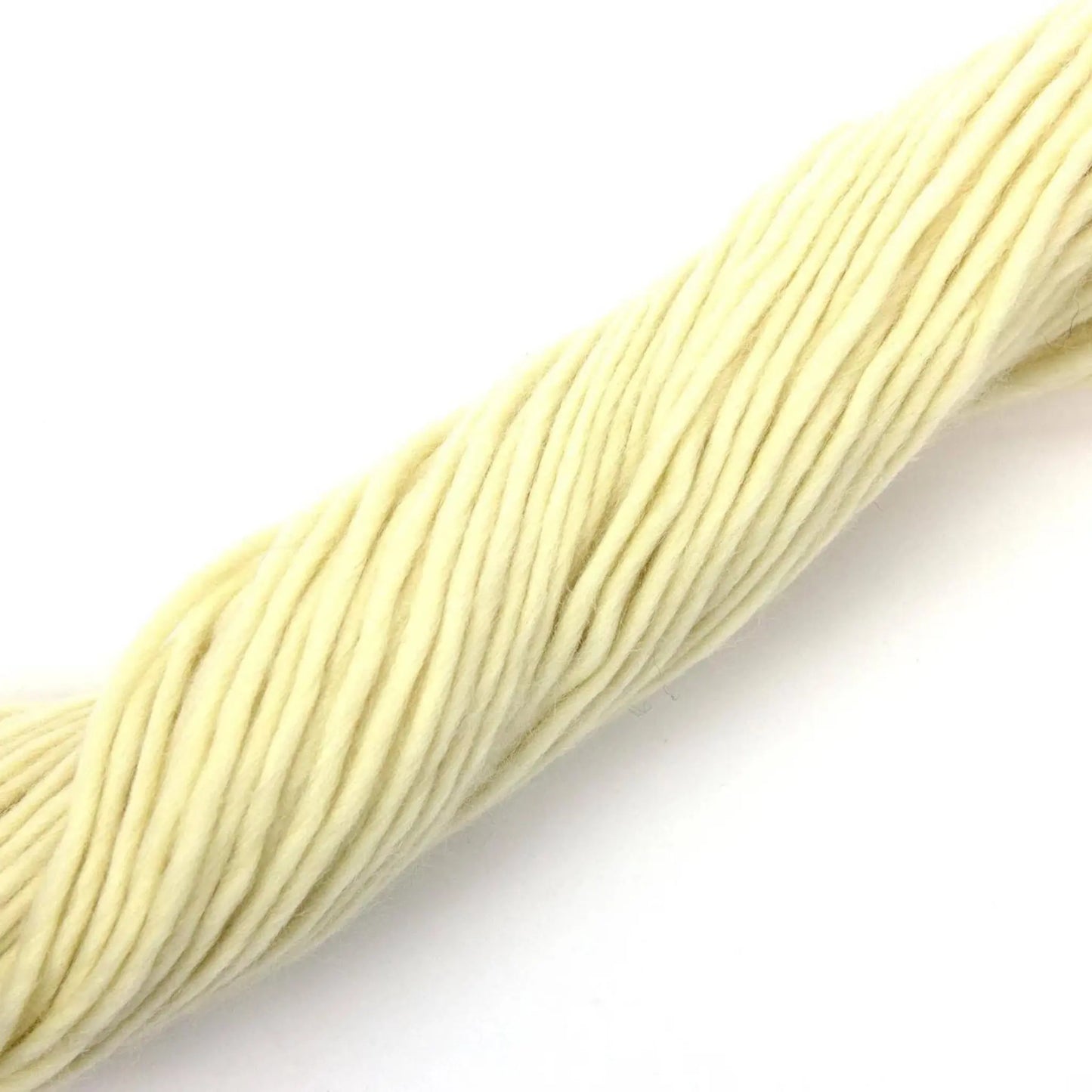 Undyed Corriedale wool yarn fibers pulled into strands