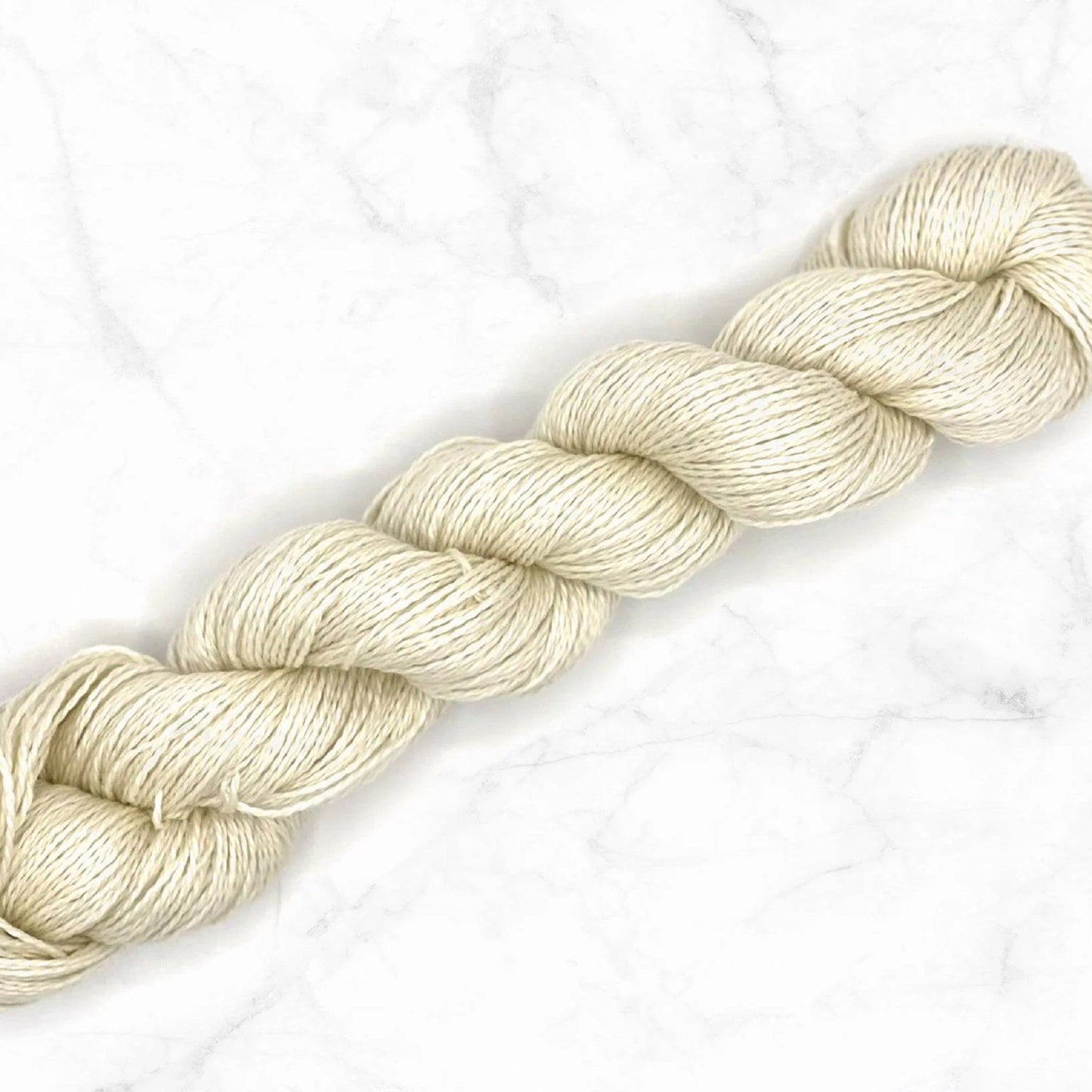 Close-up texture of undyed superwash merino silk cashmere yarn blend