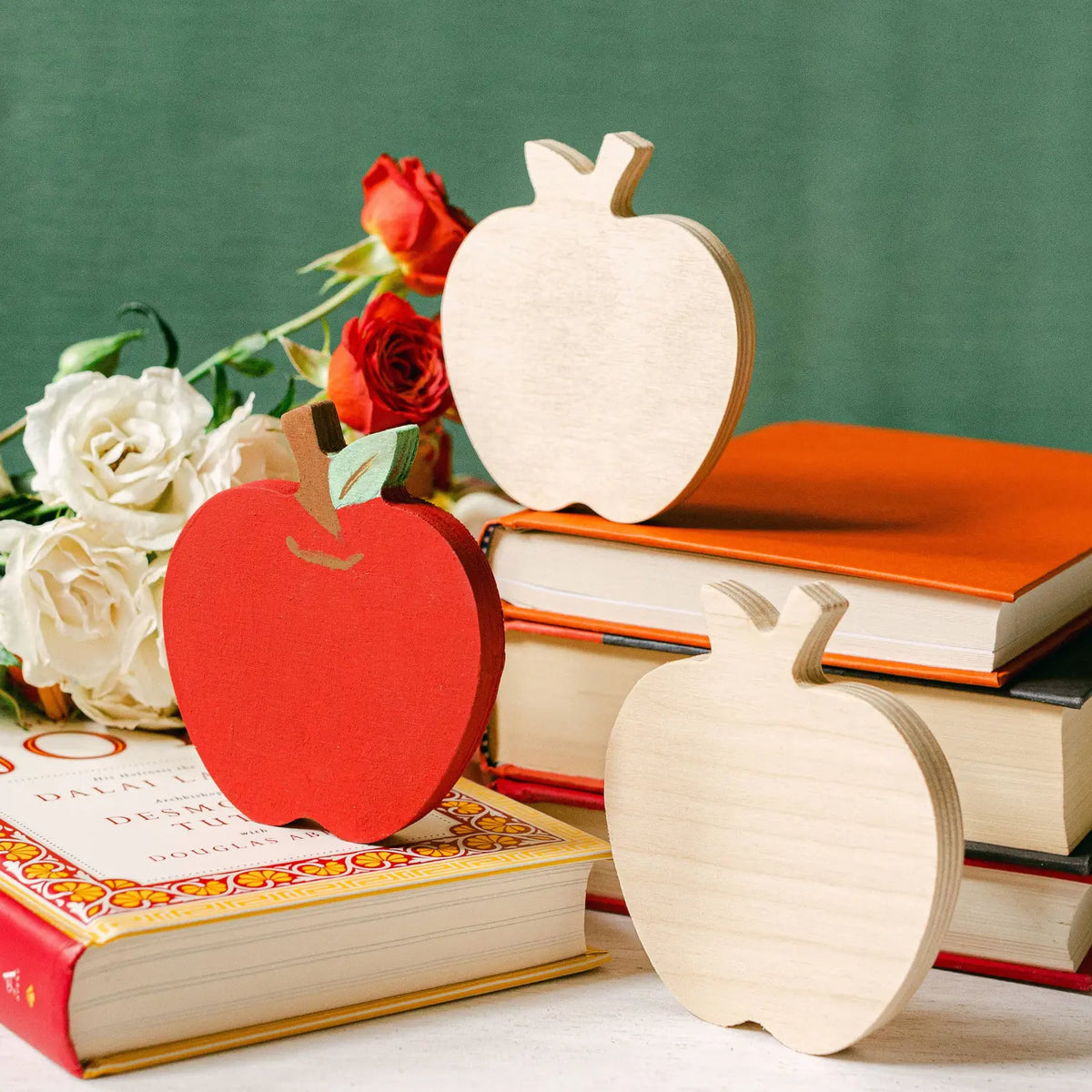 Unfinished wooden apple craft blank displayed in a September apple-themed back to school teacher gift