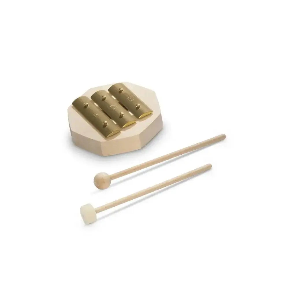 Small brass glockenspiel instrument for children with two mallets on a white background
