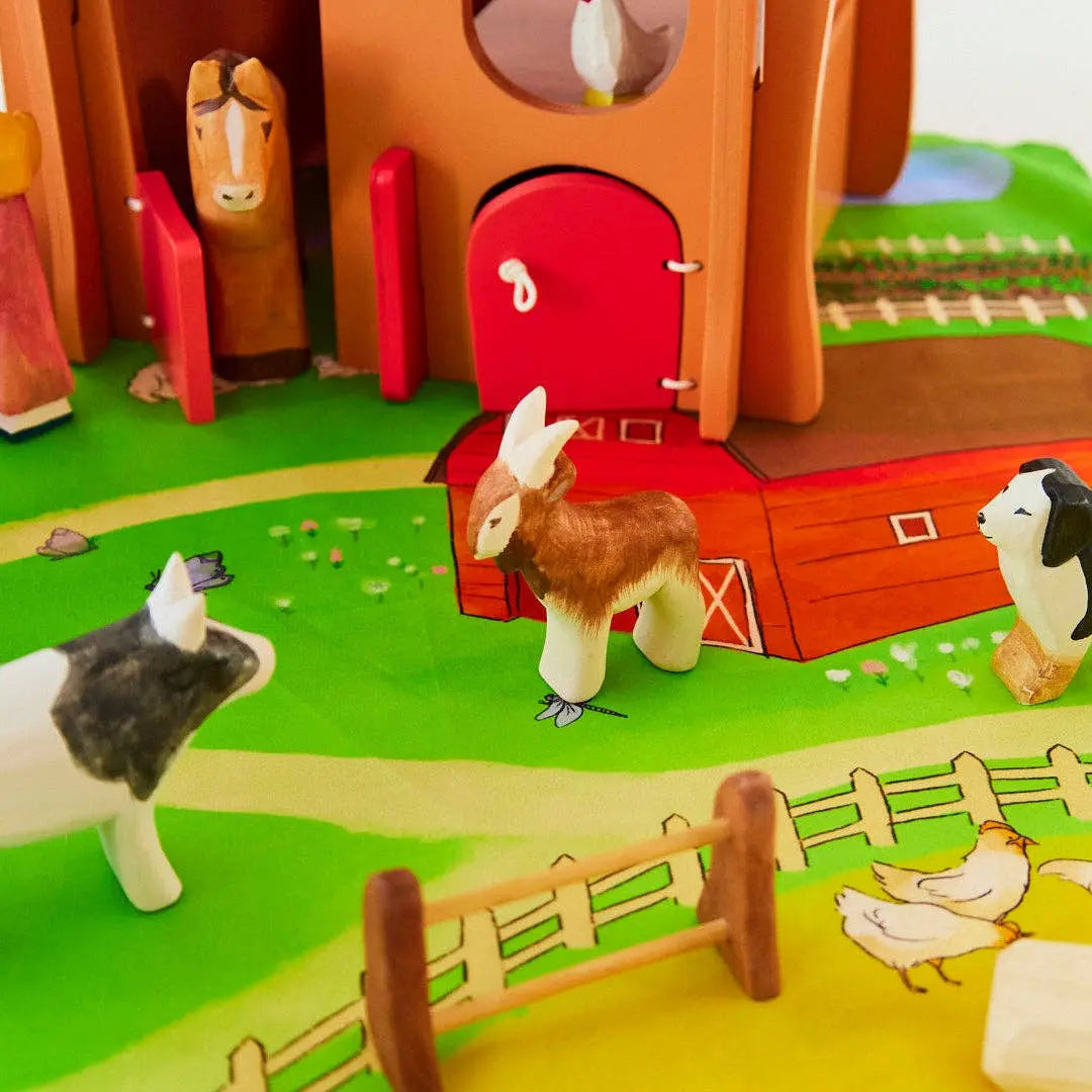 Wooden goat toy with other wooden farm animals for small world play and storytelling scenes