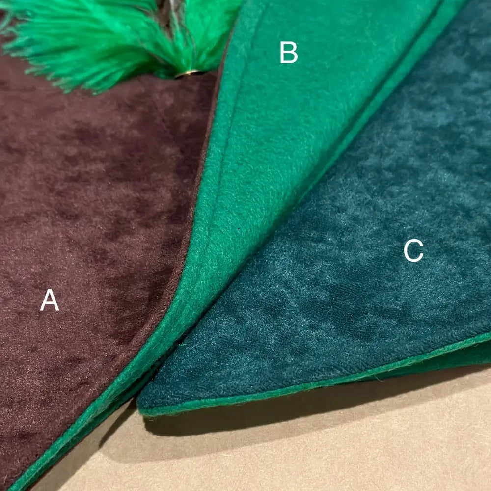 Close-up of woodsman hat fabric showing brown and green color options and texture