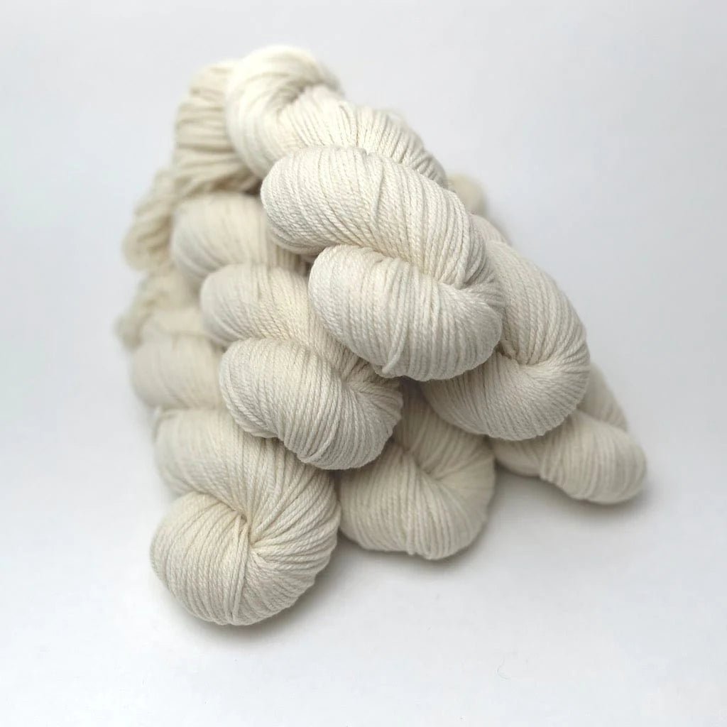 Stacks of Natural Yarn Hanks from Targhee Sheep 3-Ply DK/Worsted yarn