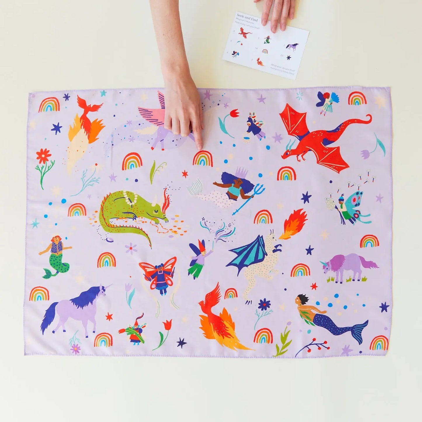 Girl playing with Magical Creatures Seek and Find Playsilk