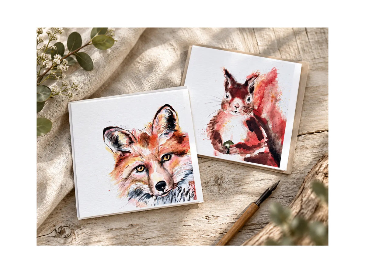 Kate Moby animal greeting cards featuring a fox and red squirrel on a natural wood and linen background