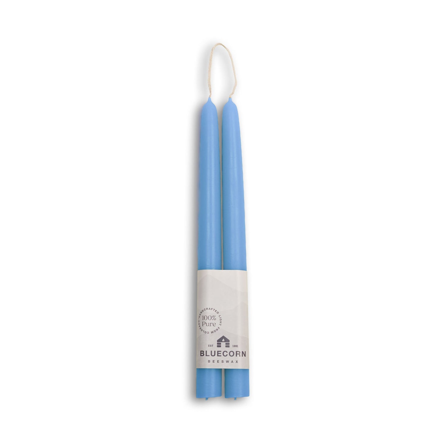 Two blue candles in a white holder with 'Bluecorn' branding on a white background