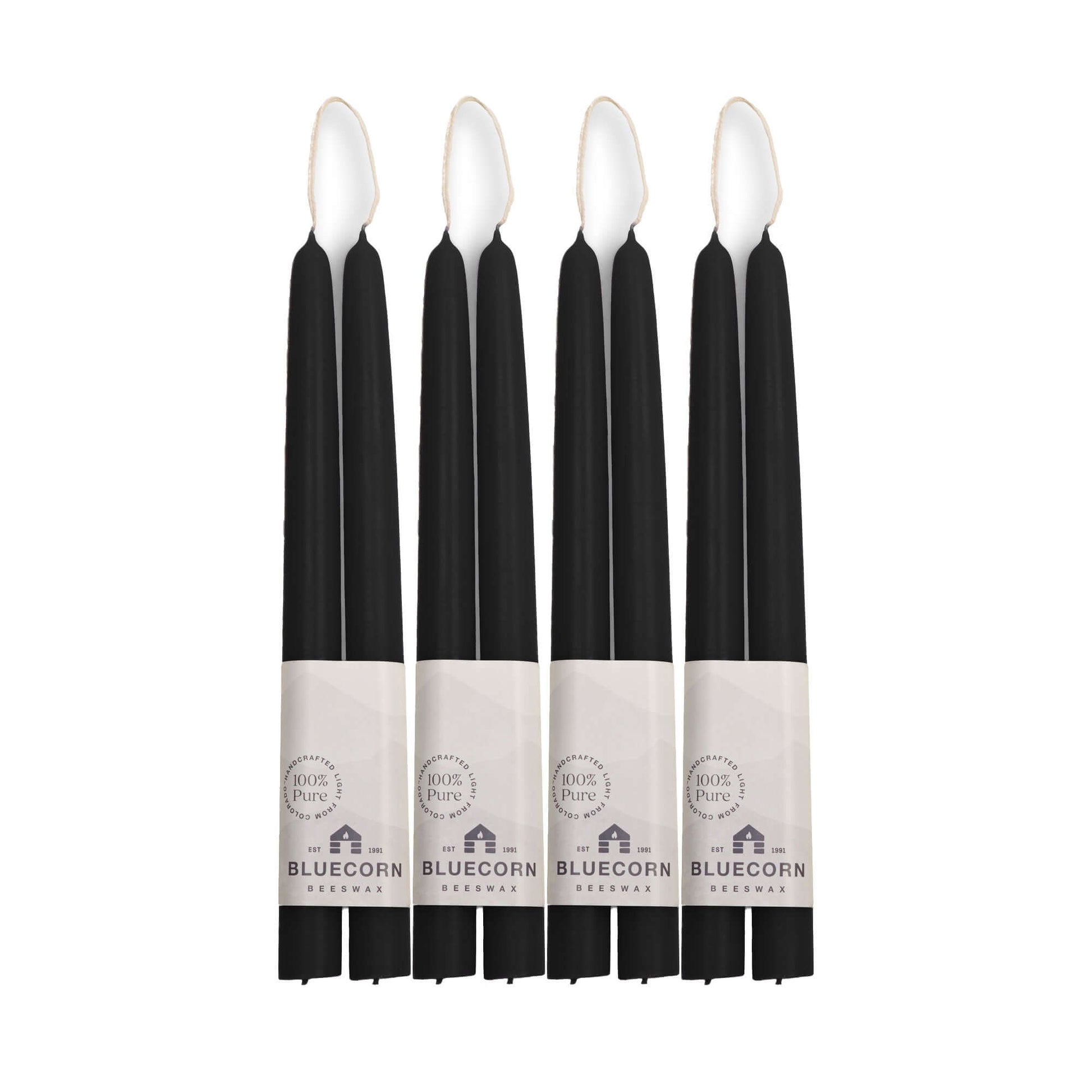 Set of black 10-inch beeswax candles with white labels 