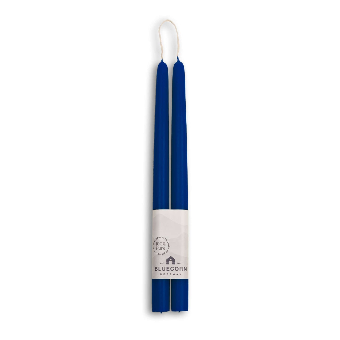 Two blue candles in a white holder with 'Bluecorn' branding on a white background
