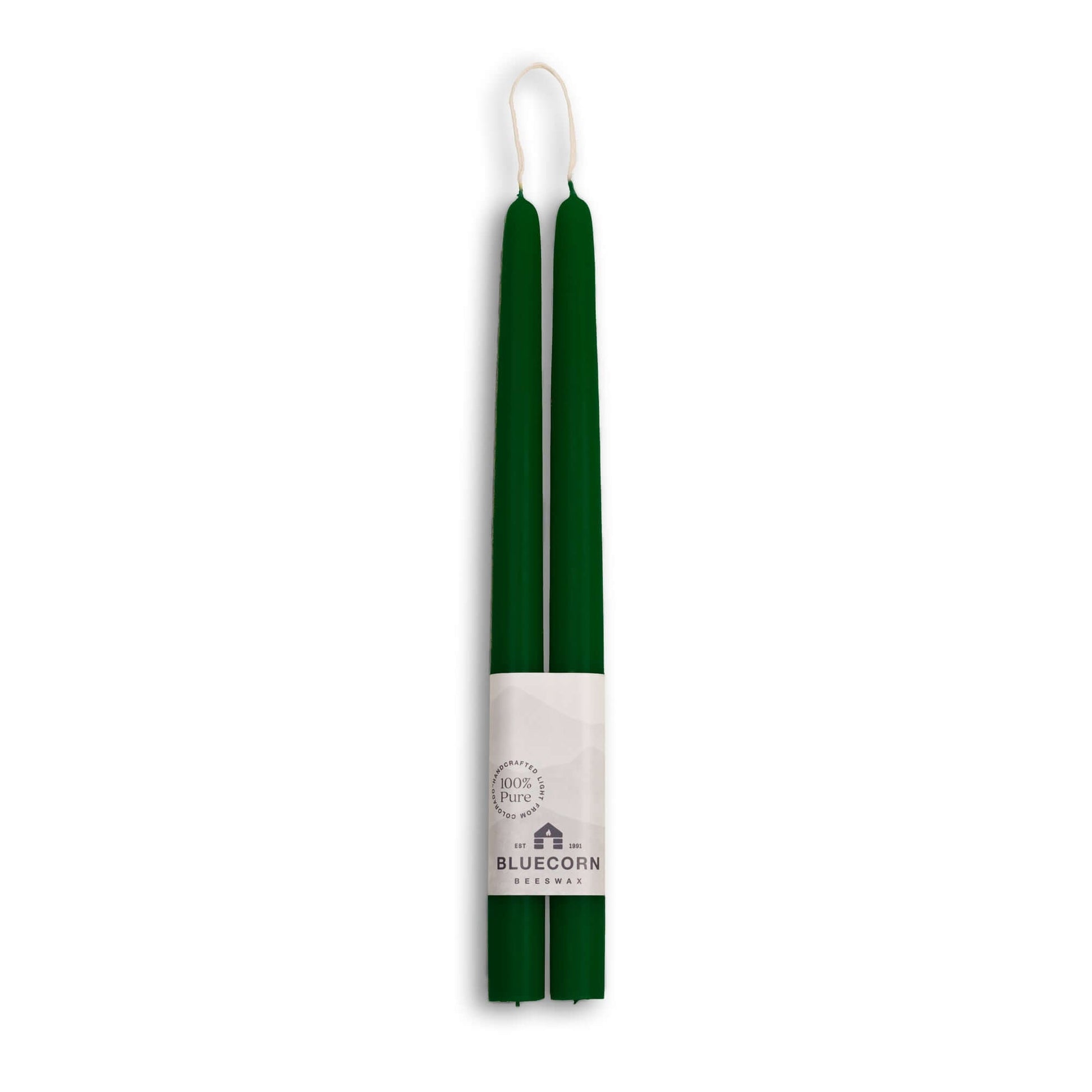 Green candles with a white label on a white background