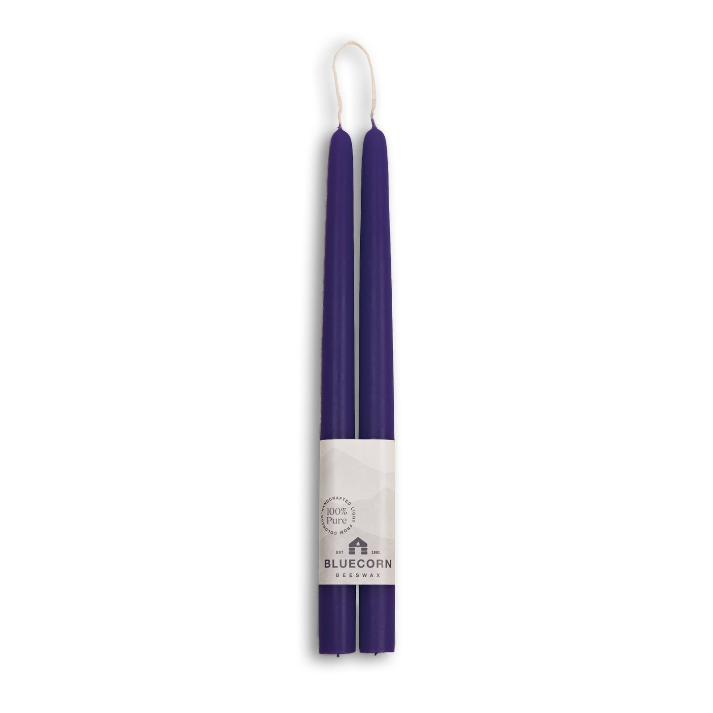 Two 12 inch eggplant candles with a white label on a white background