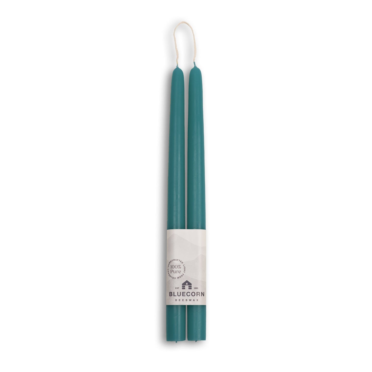 Two teal candles in a white holder with Bluecorn branding on a white background