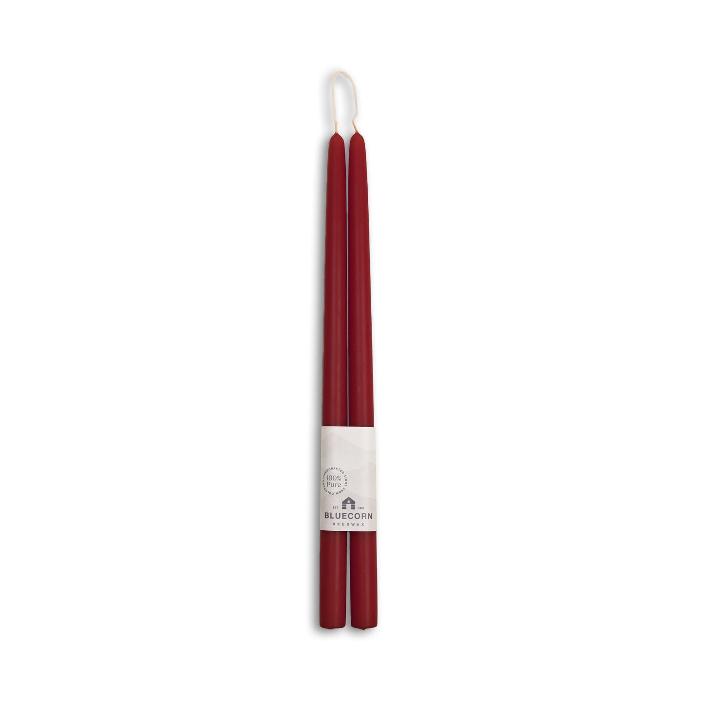 Two burgundy candles with a white label on a white background