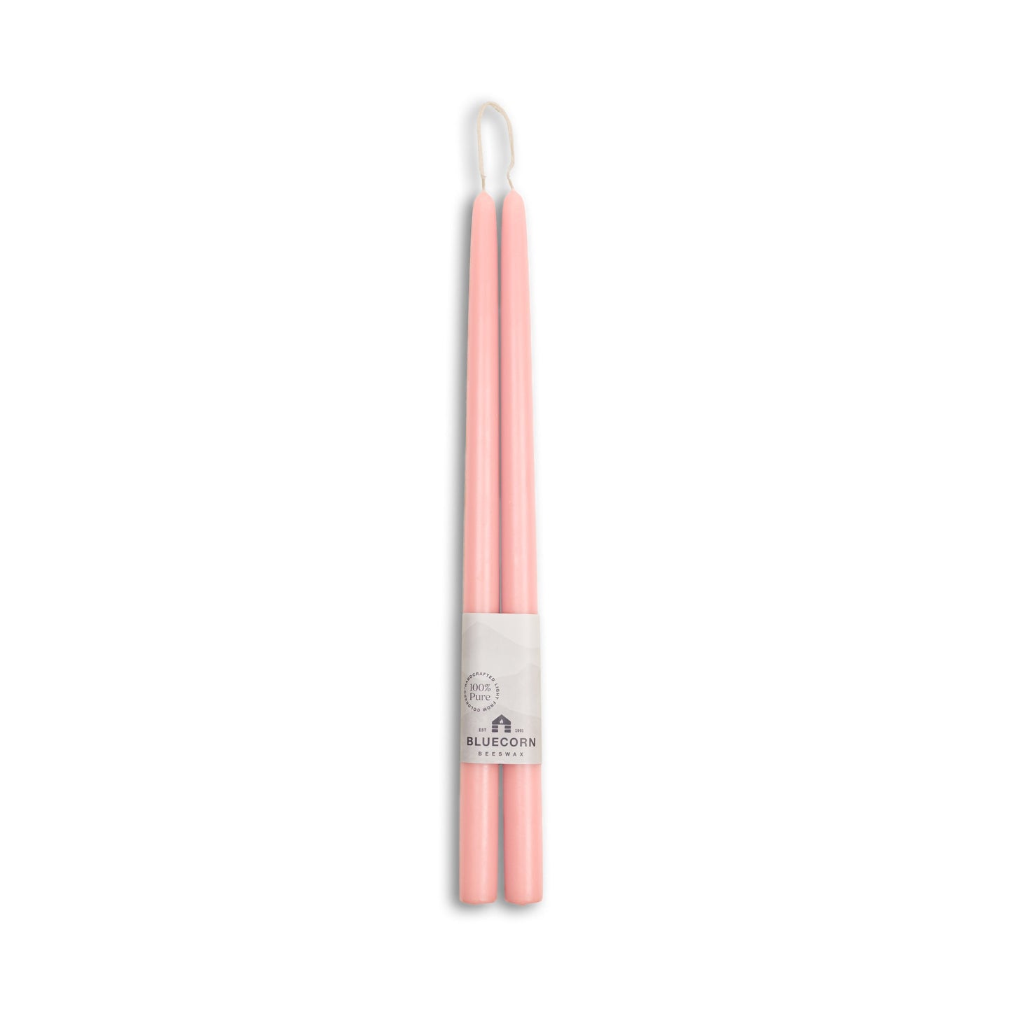 Pink and white candles with a visible brand label on a white background