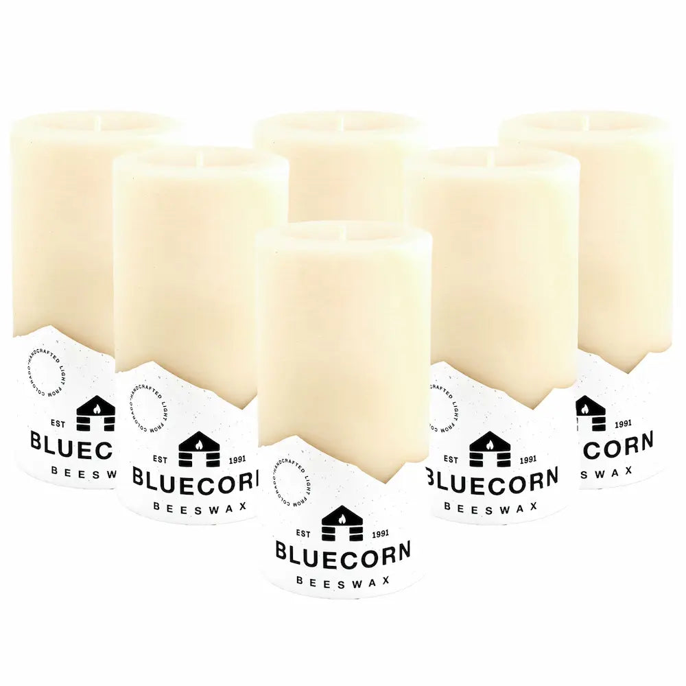 Three bars of Bluecorn Beeswax with packaging on a white background