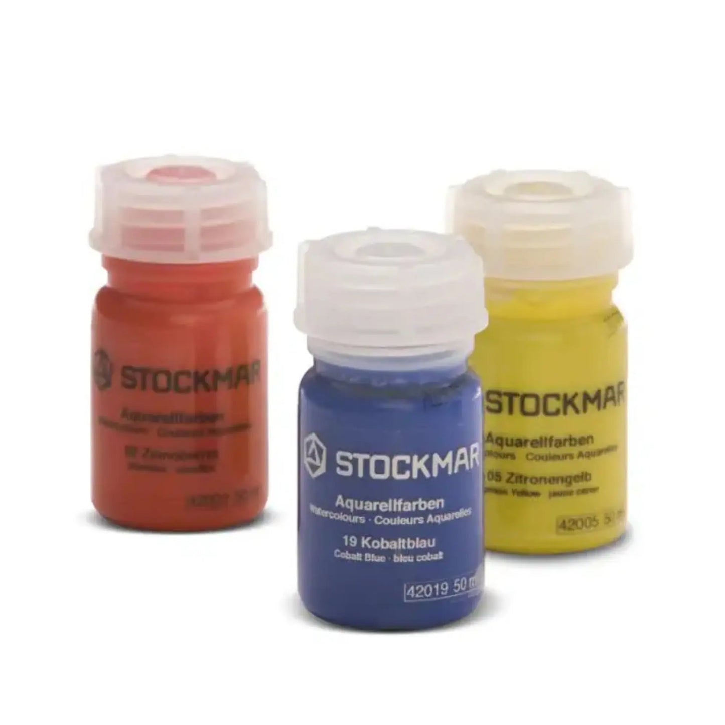 Three bottles of Stockmar watercolor paint in red, blue, and yellow on a white background.