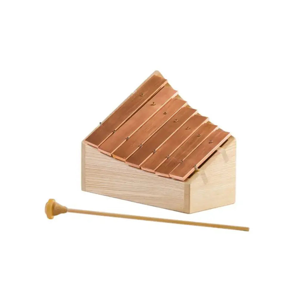 Copper and wooden pentatonic glockenspiel with mallet on white background