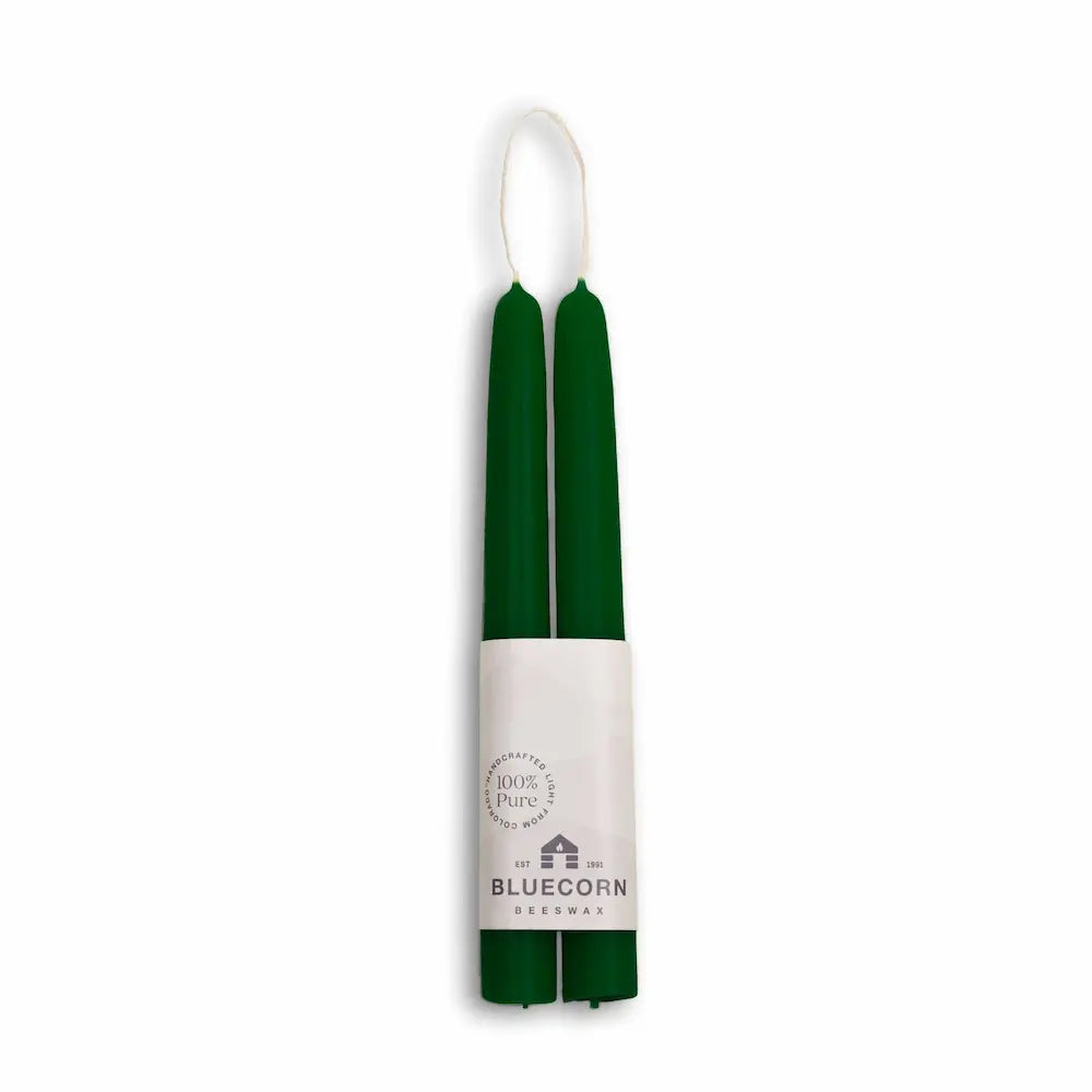 Green candles with a white label on a white background