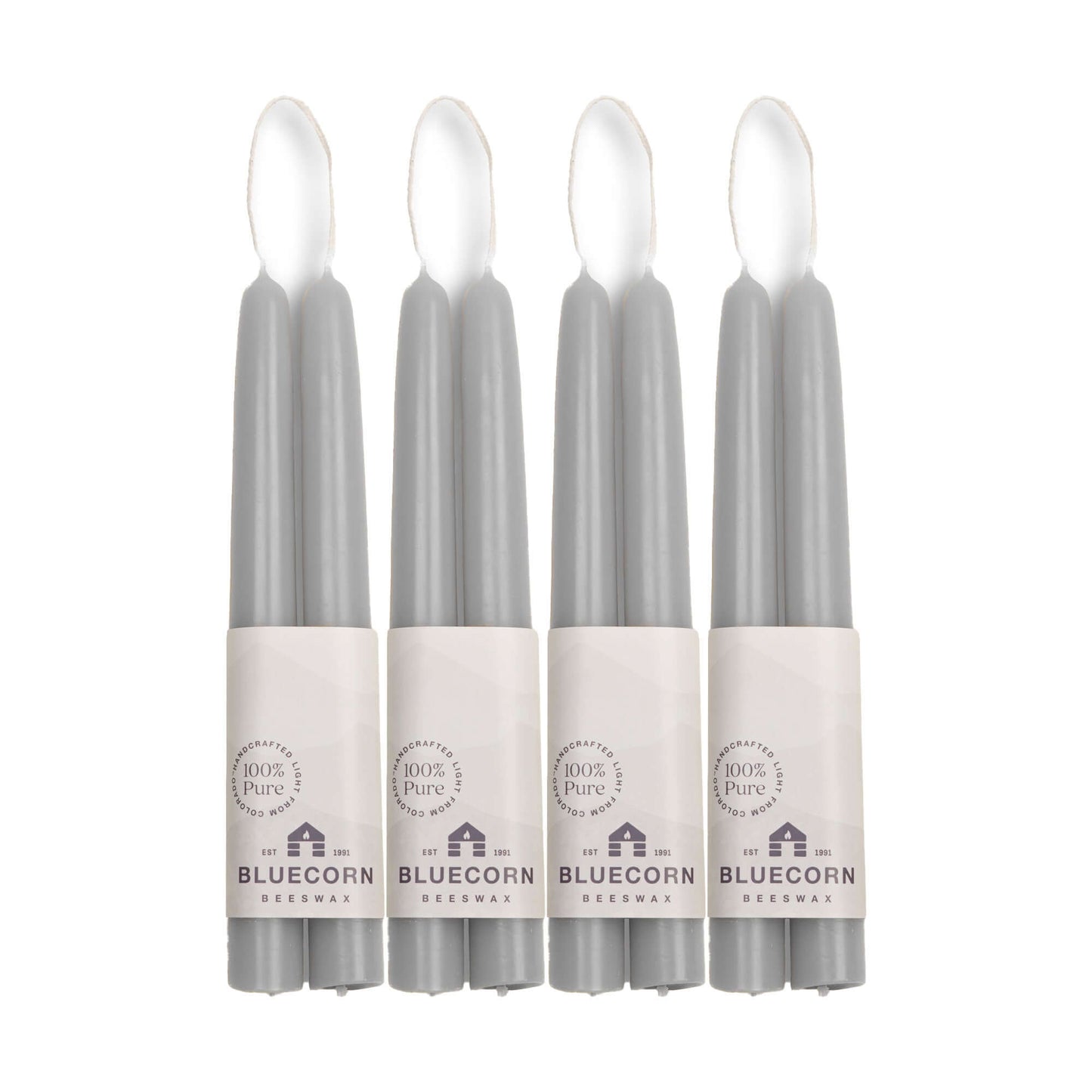Four gray 8-inch beeswax taper candles in packaging with 'Bluecorn' 