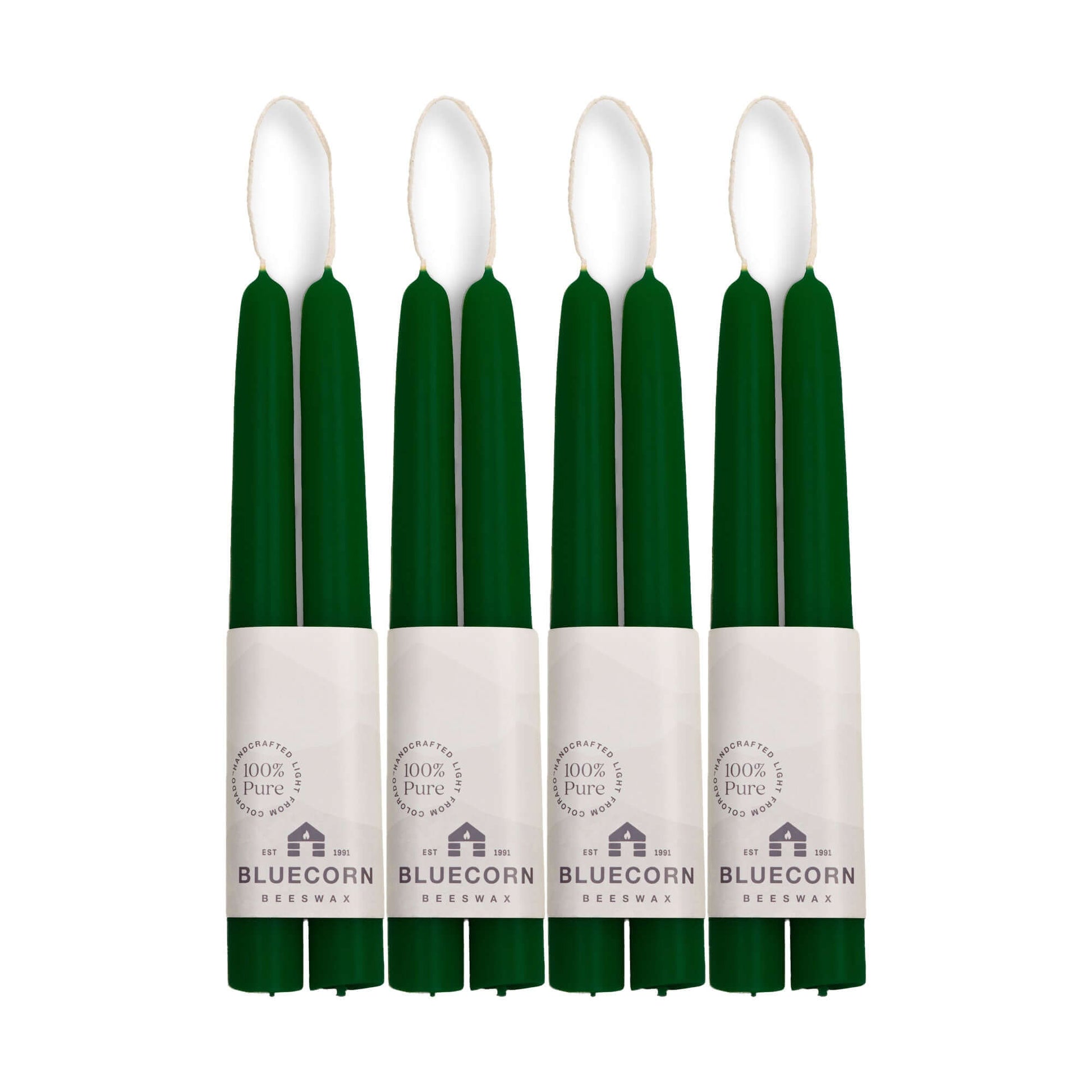 Moss green 8-inch candles with white labels on a white background