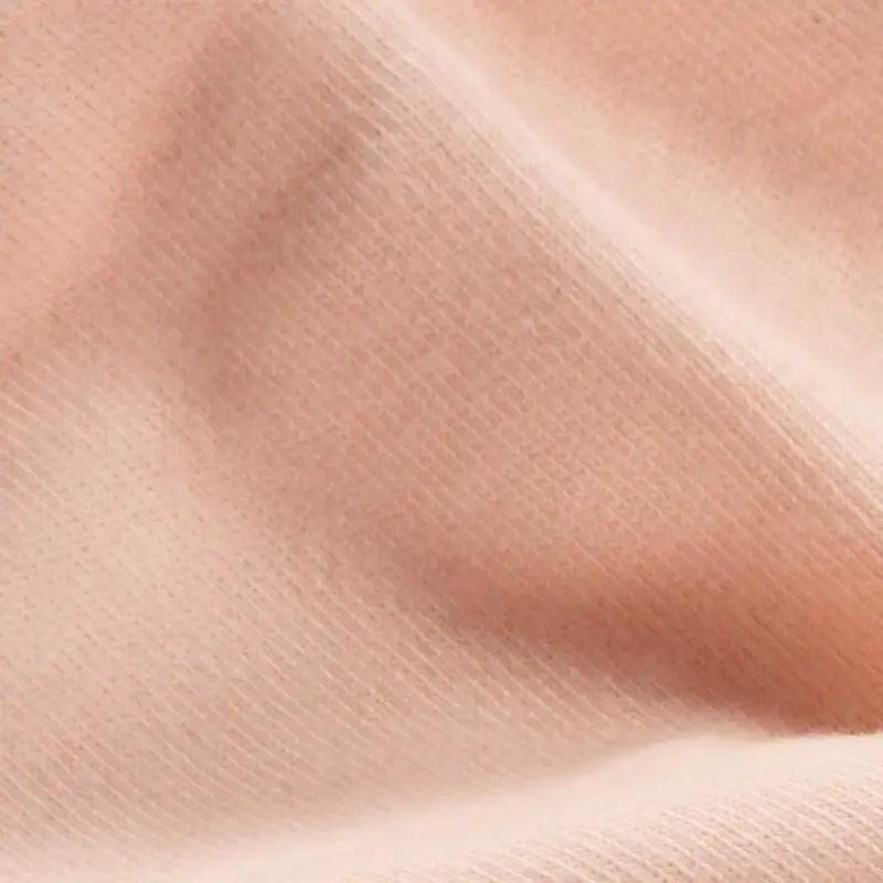 Close-up of apricot organic doll making fabric texture