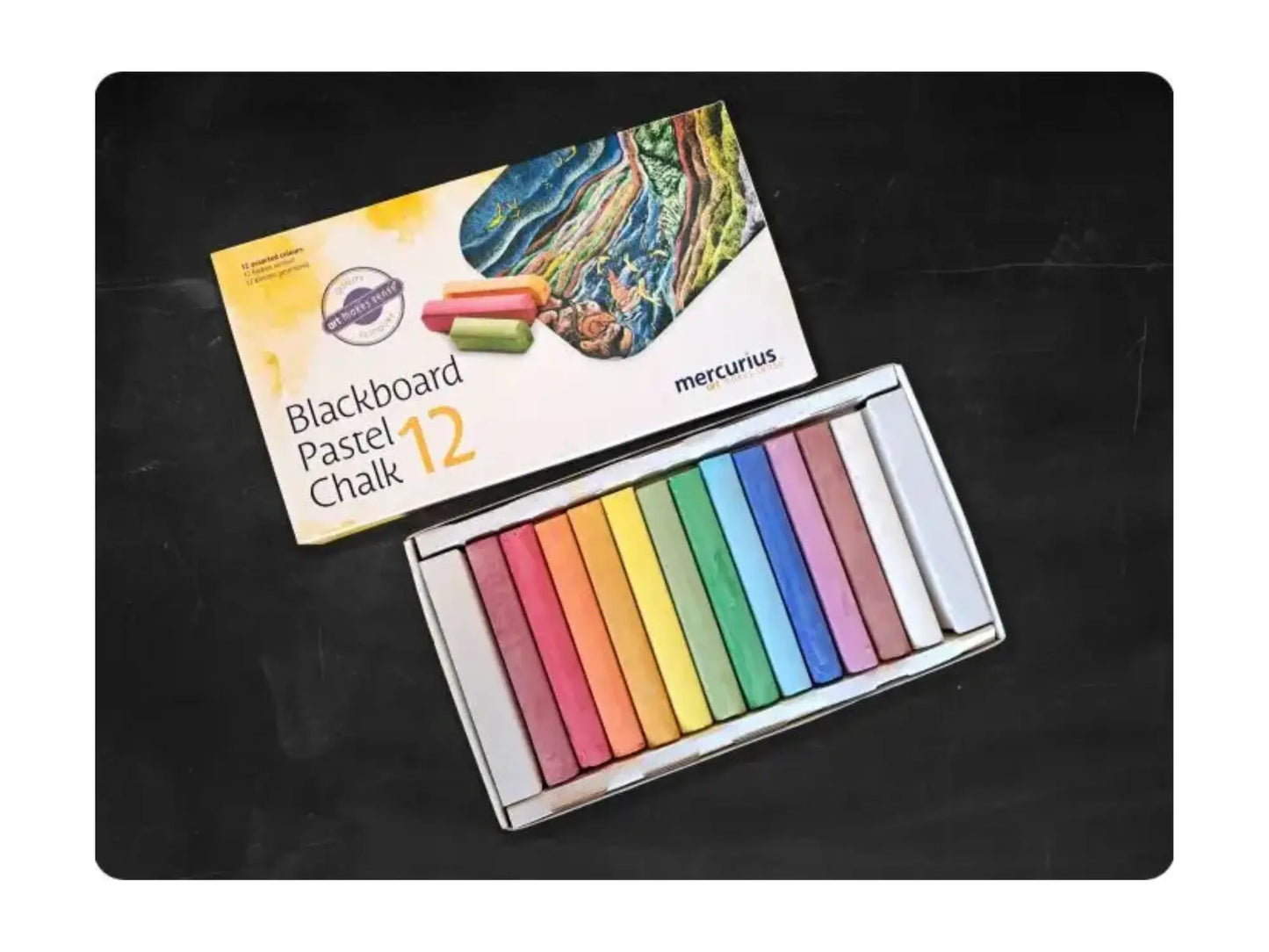 Set of colorful pastel chalks with packaging on a blackboard background
