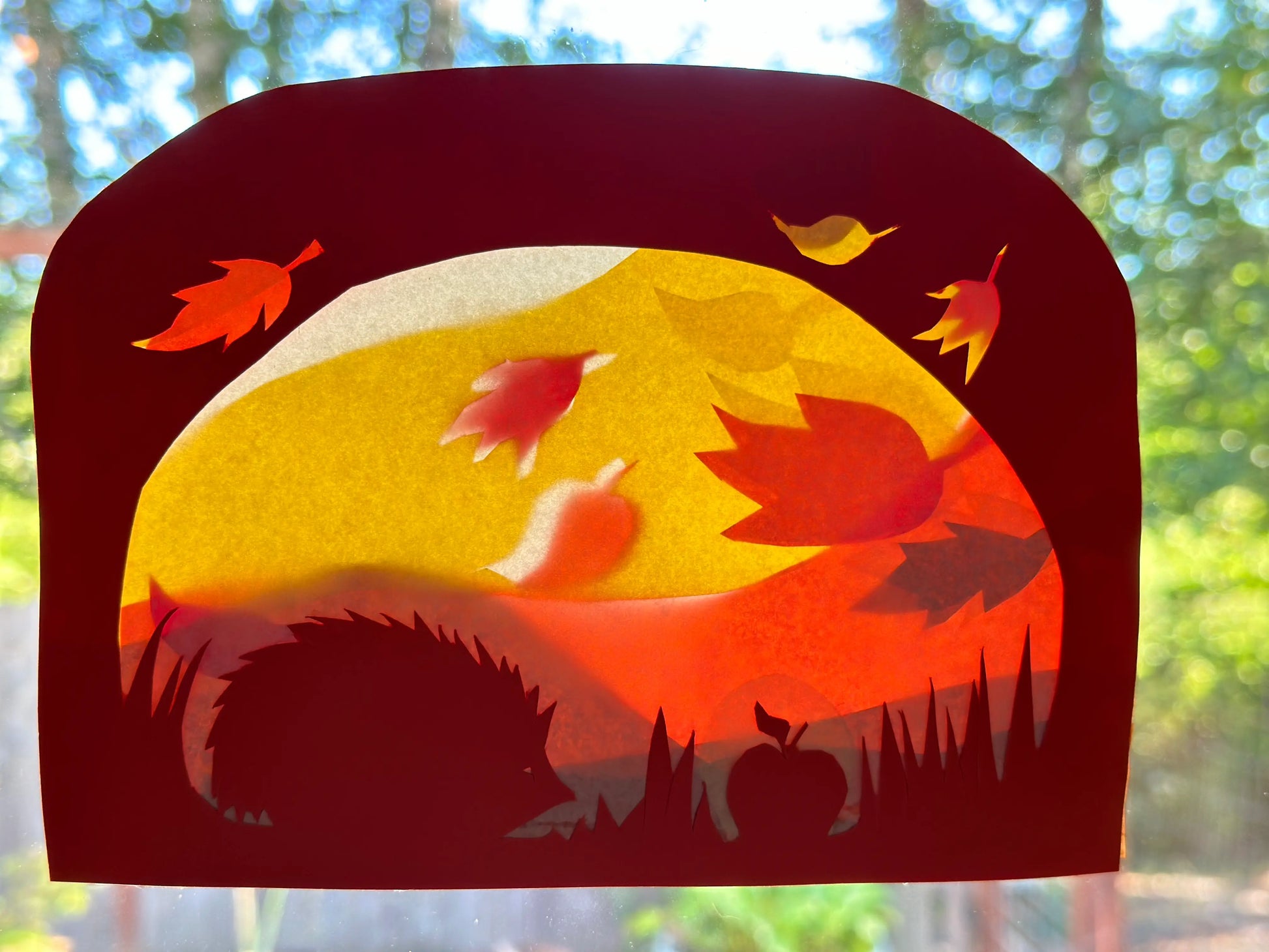 Autumn Transparent Window Scene of a Hedgehog, apple and autumn leaves falling