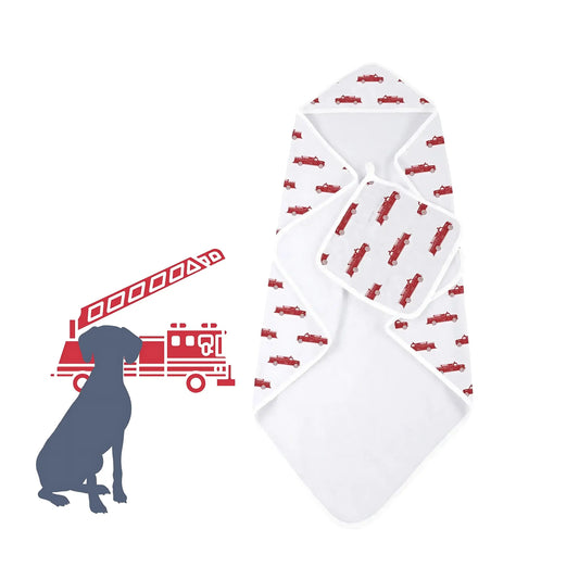 White baby hooded towel and washcloth set laid out with red fire truck pattern and a silhouette of a dog 