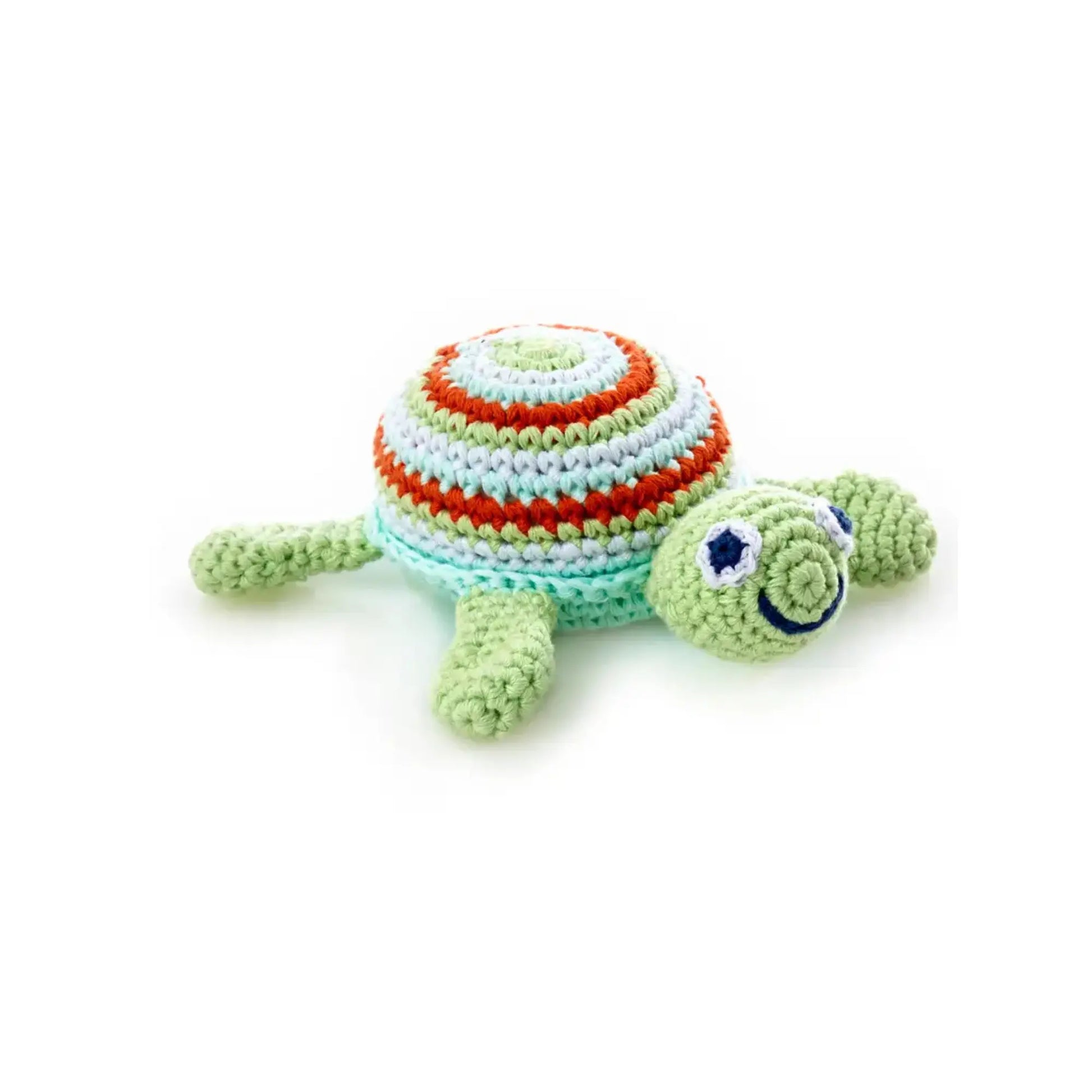 Close-up of handmade knitted sea turtle baby rattle in soft cotton yarn