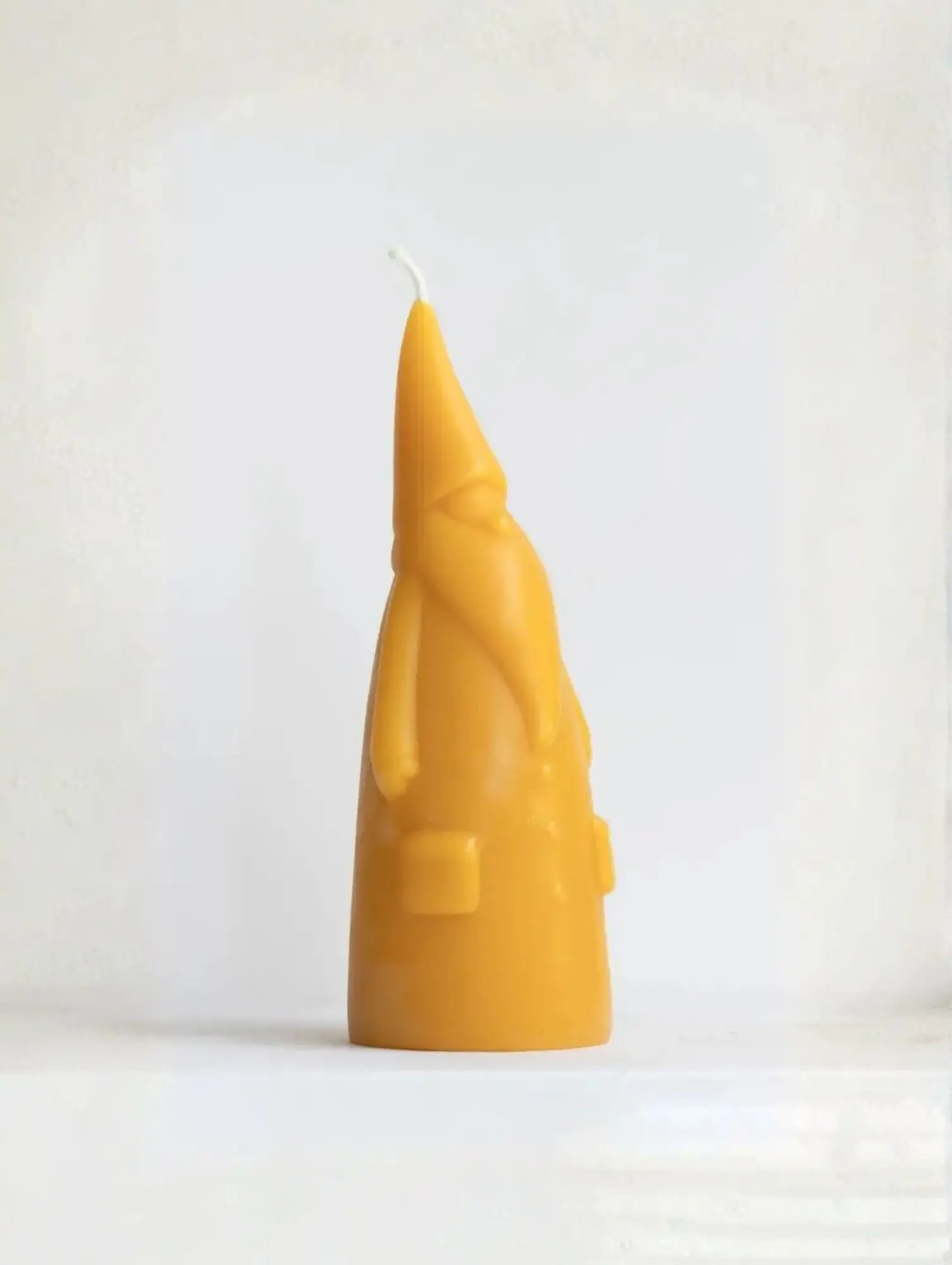 Short Santa Claus Beeswax Candle on white background