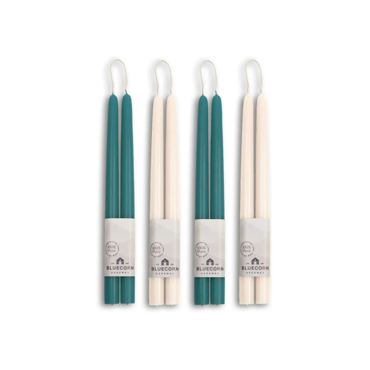 Four teal and beige candles with visible branding on a white background