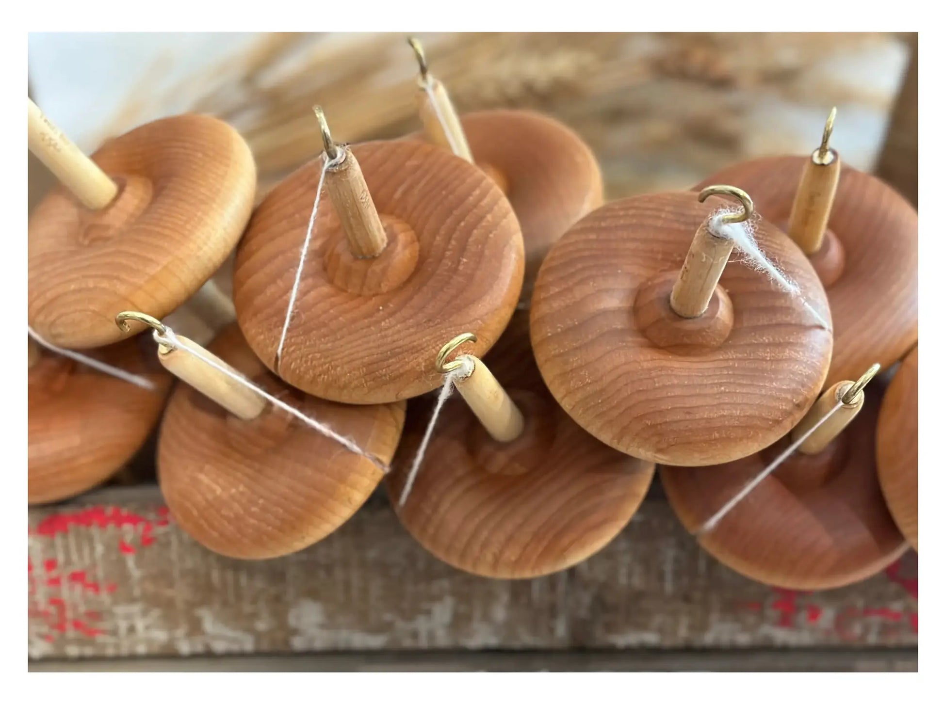 Close up of a Group of Wooden Drop Spindles also known as a Top Whorl or High Whorl Spindle
