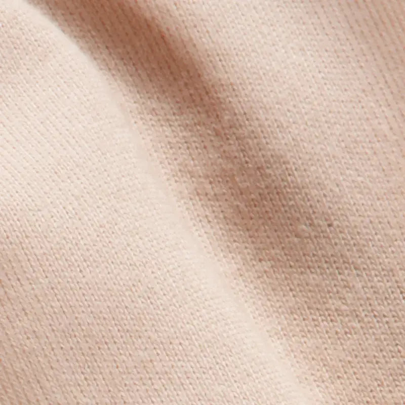 Close-up of beige organic doll making fabric texture