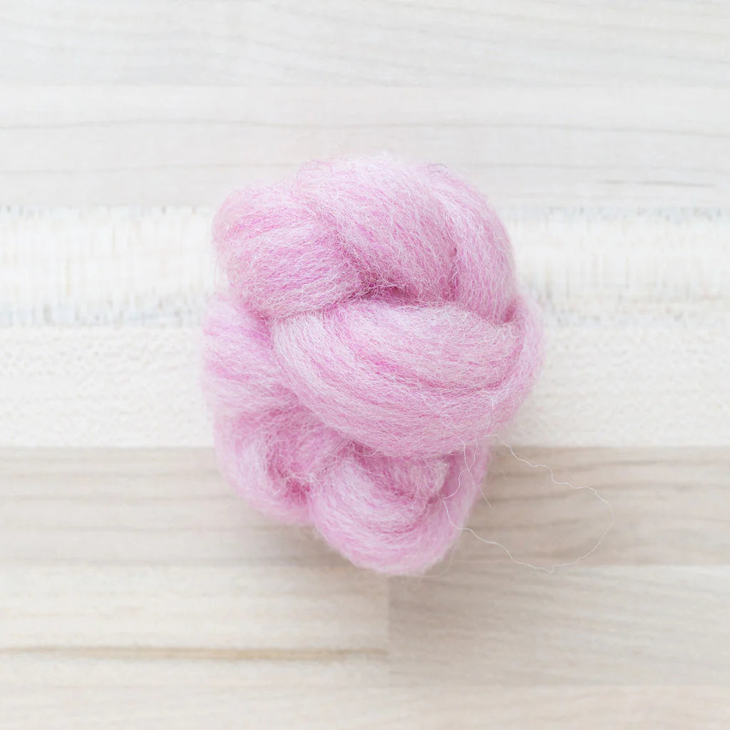 Bubblegum Pink Wool Roving Felter's Fowing on tabletop