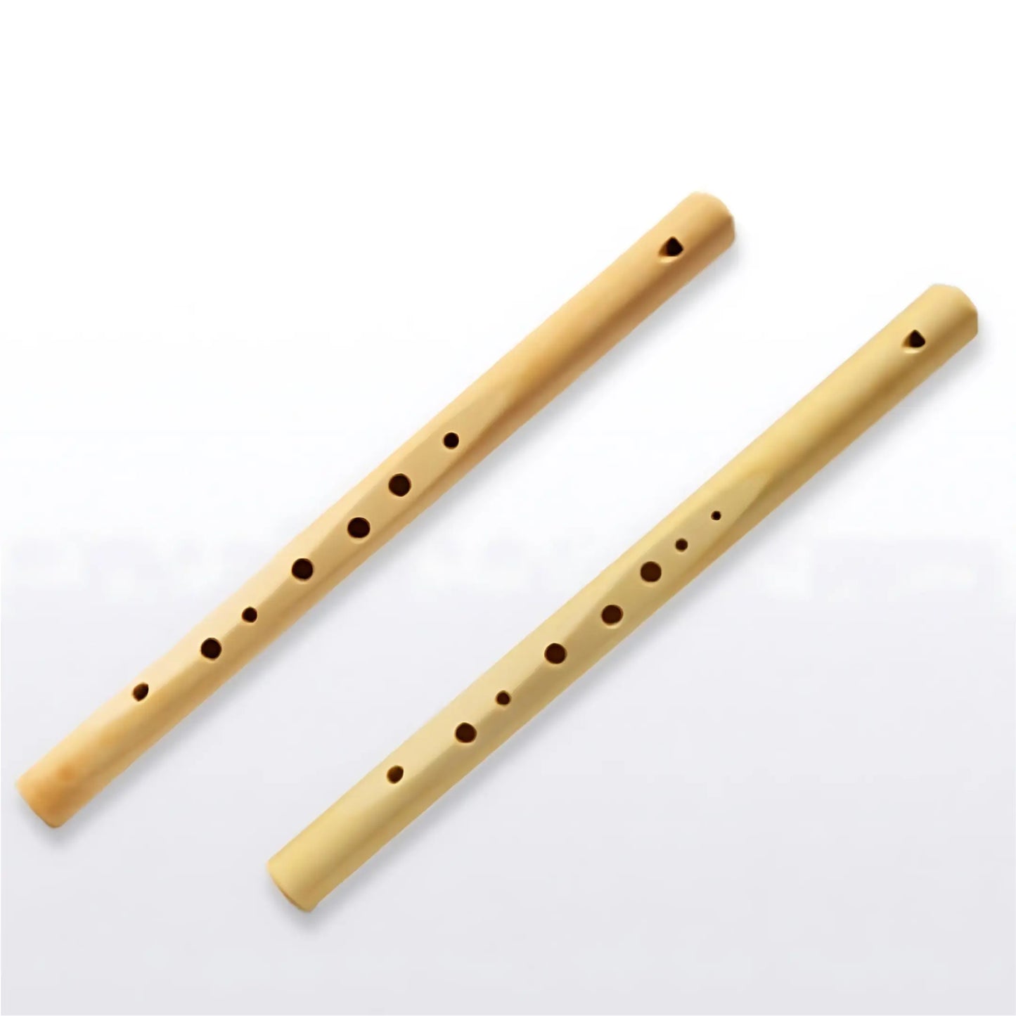 Two wooden maple flutes - one pentatonic and one diatonic - on a white background