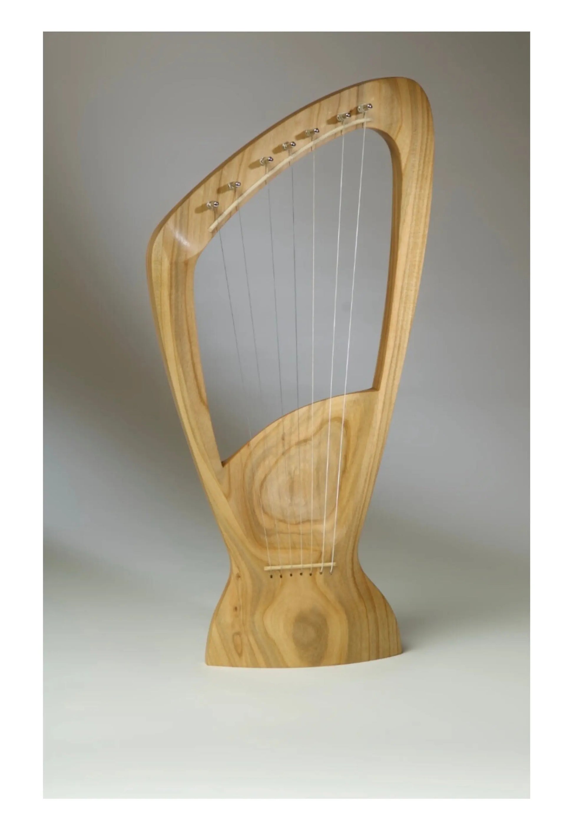 Choroi 7-String Pentatonic Lyre Ash, Cherry, Maple on a grey background