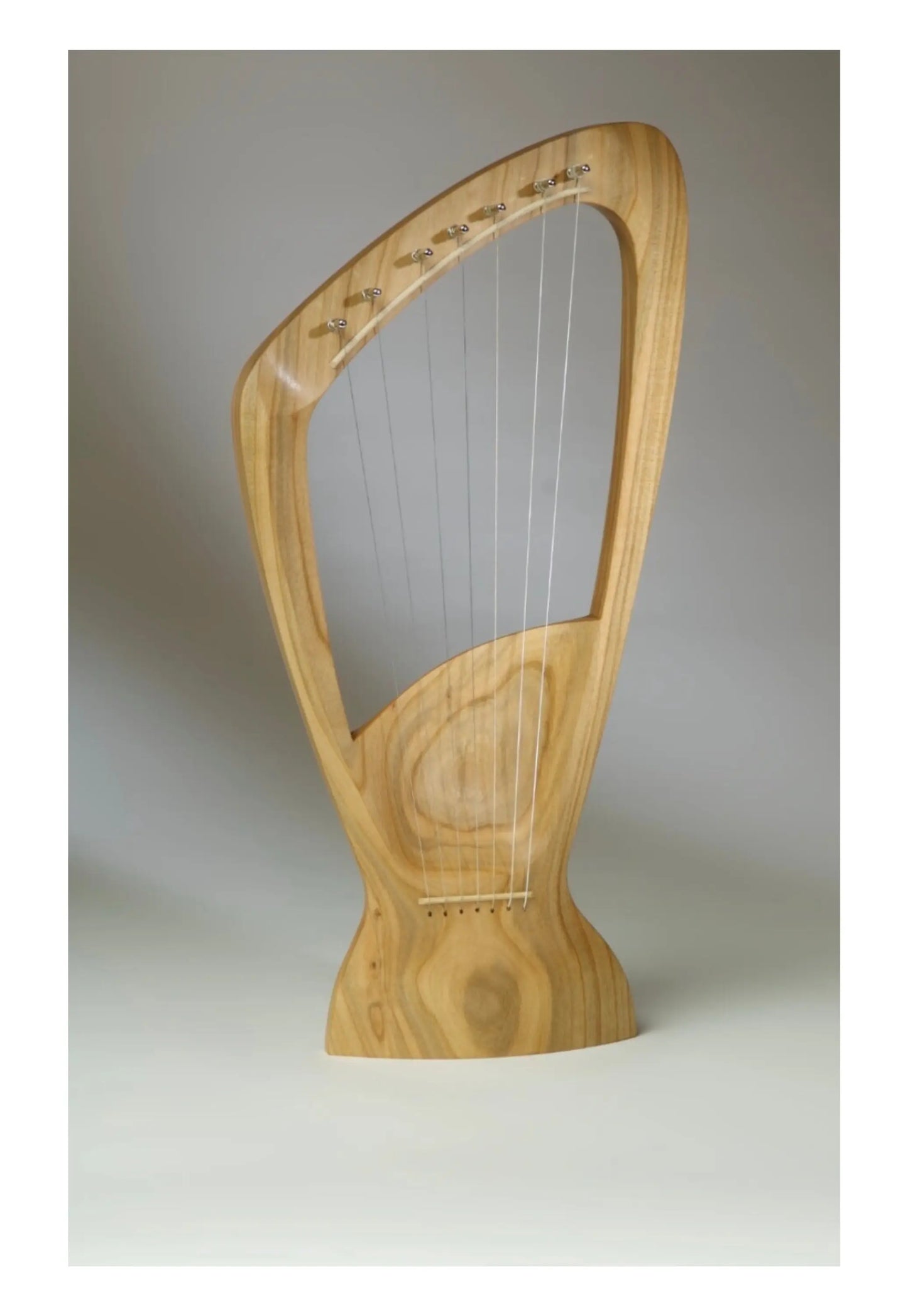 Choroi 7-String Pentatonic Lyre Ash, Cherry, Maple on a grey background