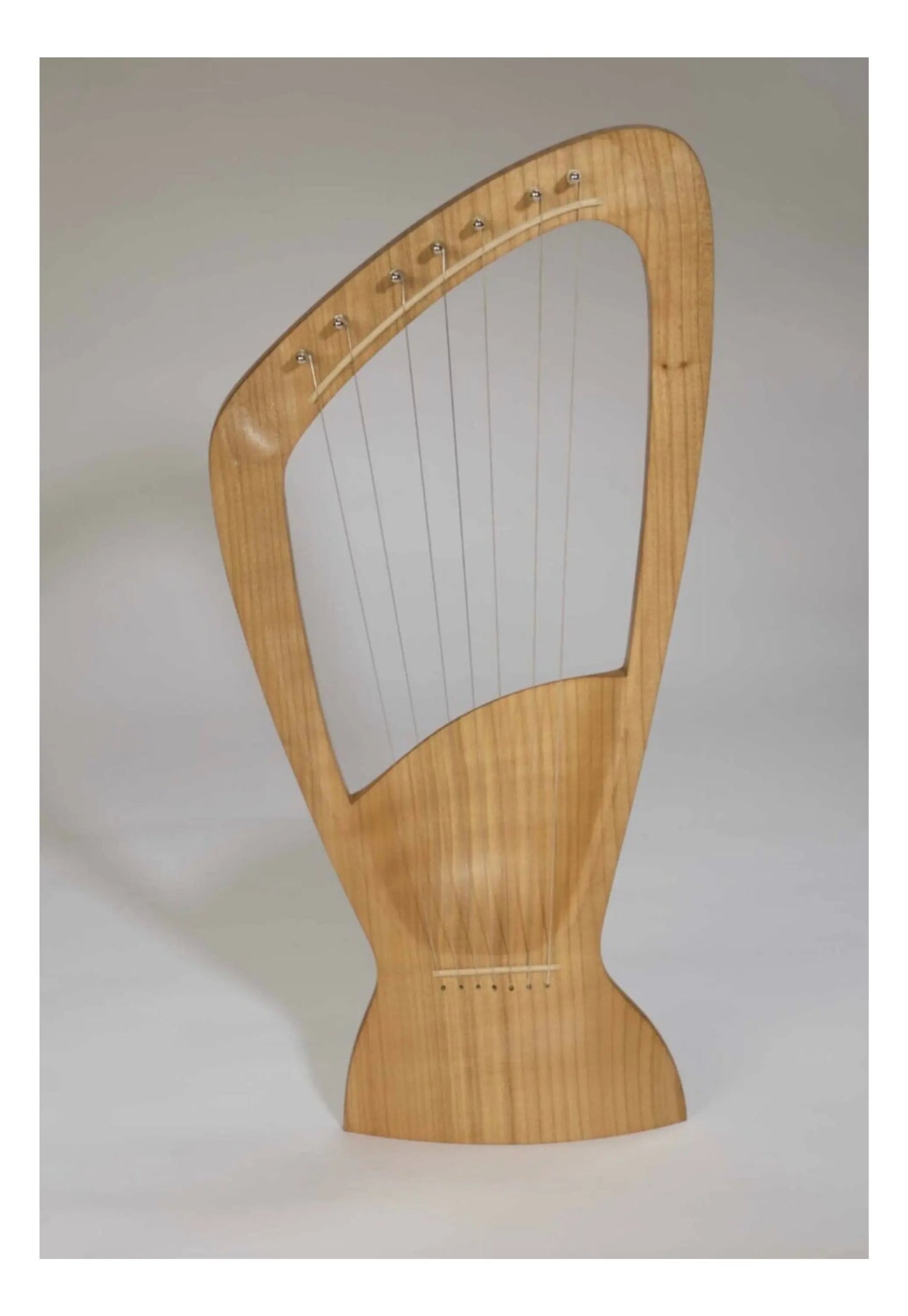 Choroi 7-String Pentatonic Lyre Ash, Cherry, Maple on a grey background