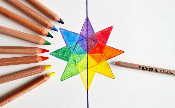 Colorful star-shaped geometric design with art makes sense colored pencils on a white background
