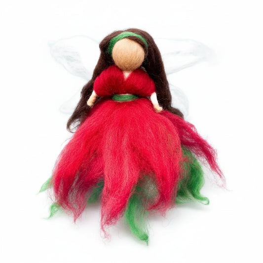 Felted fairy figurine with red and green wool dress and white wings on a light blue background