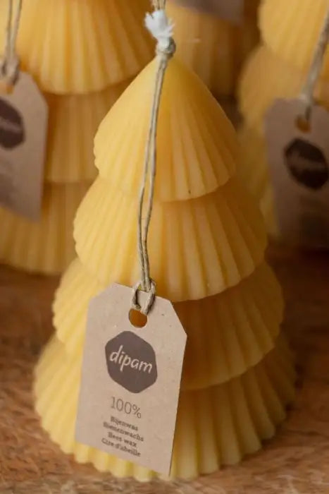 A Beeswax Christmas Tree Candle with Kraft Dipam Tag