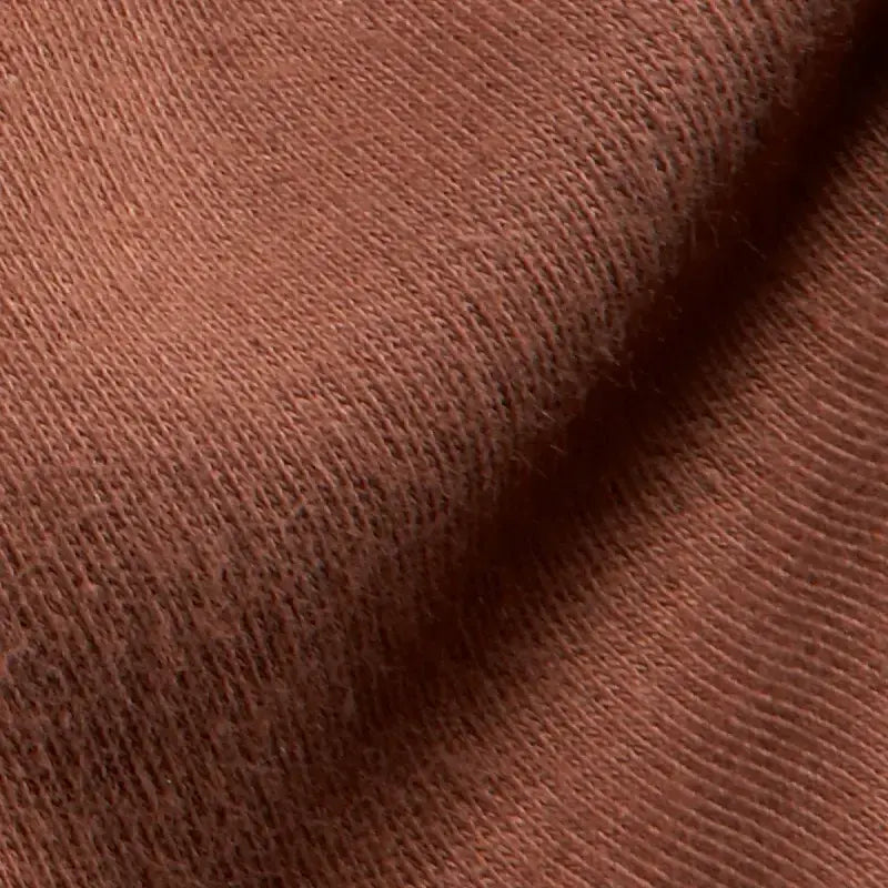 Close-up of brown organic doll making fabric texture