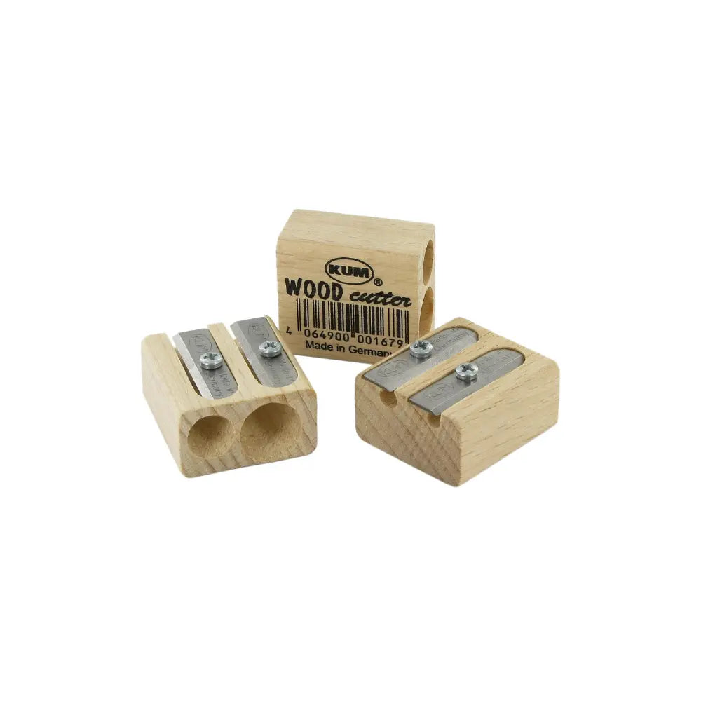 Wooden pencil sharpener with metal blades on a white background